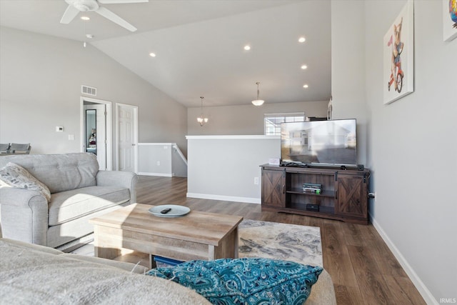 living room with visible vents, high vaulted ceiling, a ceiling fan, wood finished floors, and baseboards