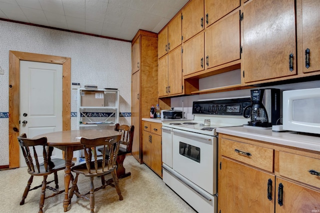 12228 Indiana St, Leopold, IN 47551 - kitchen featuring wallpapered walls, white appliances, brown cabinetry, light countertops, and crown molding