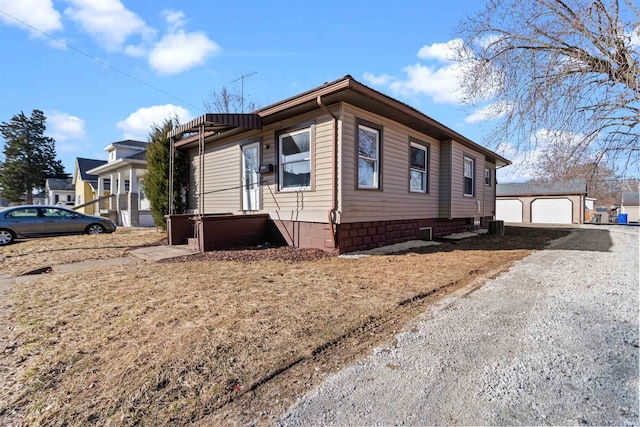 view of side of property featuring crawl space and an outdoor structure