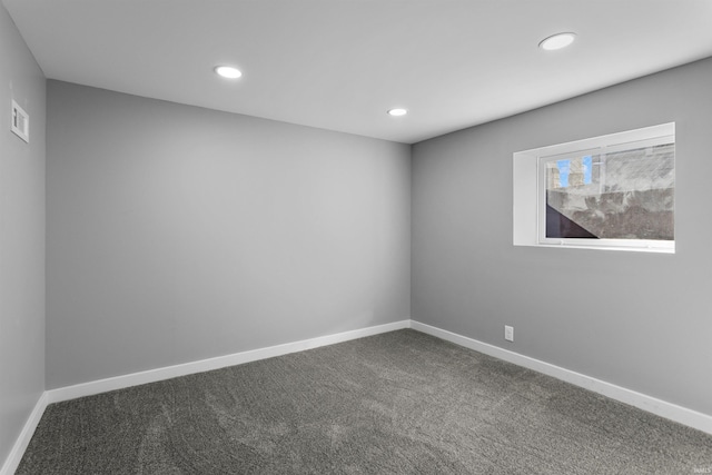 unfurnished room featuring recessed lighting, visible vents, baseboards, and dark carpet