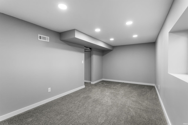 finished basement with recessed lighting, visible vents, carpet floors, and baseboards