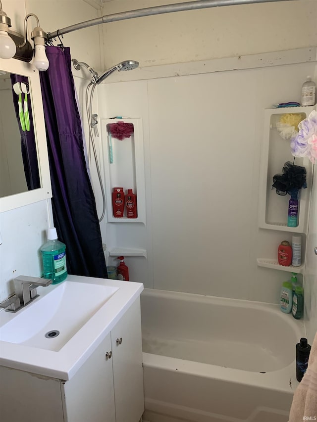 full bath featuring vanity and shower / bath combination with curtain