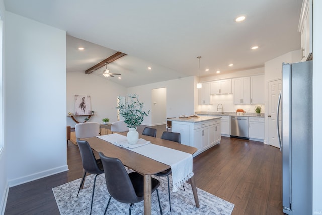 dining room featuring dark wood finished floors, lofted ceiling with beams, recessed lighting, and baseboards