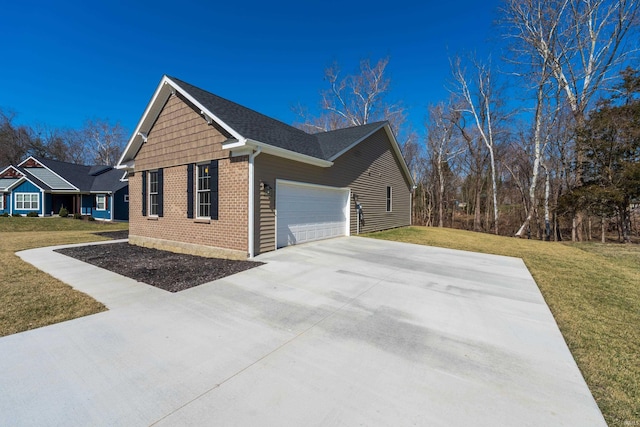 view of side of property with brick siding, driveway, a lawn, and an attached garage