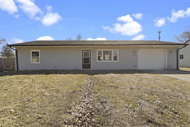 ranch-style home with driveway, a garage, and fence