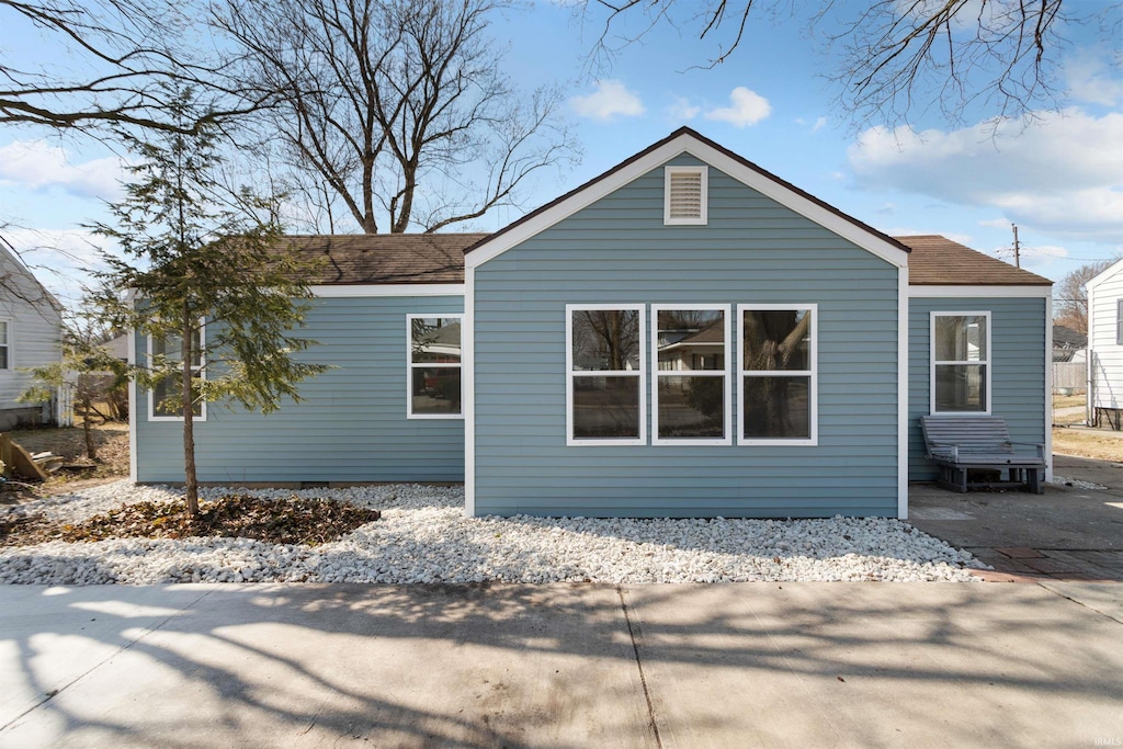 exterior space with a shingled roof