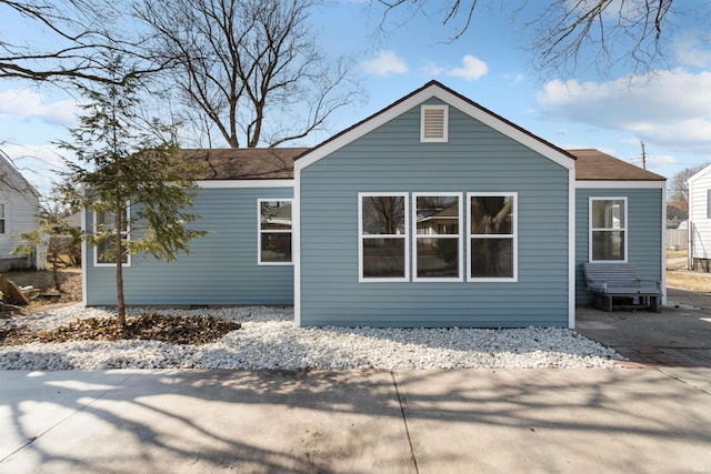 exterior space with a shingled roof