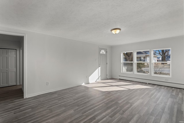 unfurnished living room featuring baseboard heating, a textured ceiling, baseboards, and wood finished floors