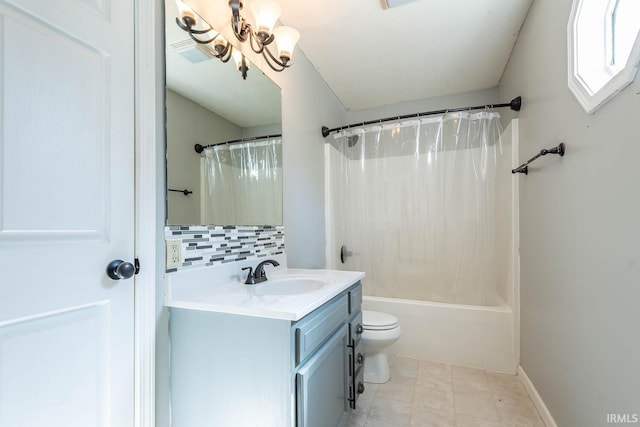 bathroom featuring shower / bath combo with shower curtain, toilet, an inviting chandelier, decorative backsplash, and vanity