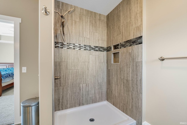 full bathroom with ensuite bath and tiled shower