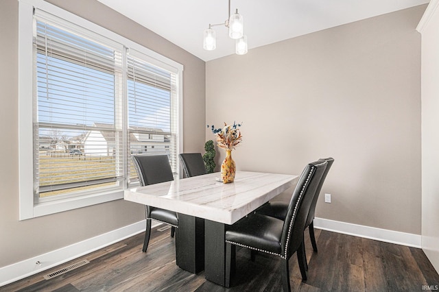 dining space featuring visible vents, baseboards, and dark wood-style flooring