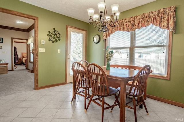 dining area featuring a textured ceiling, light tile patterned floors, baseboards, and a chandelier