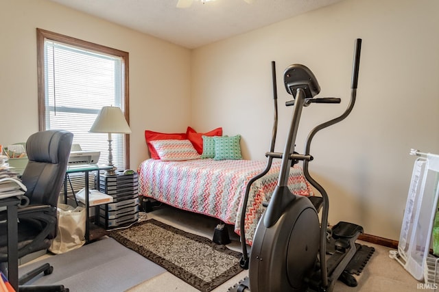 bedroom featuring carpet, baseboards, and ceiling fan