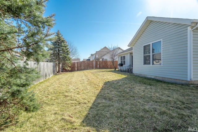 view of yard with a fenced backyard