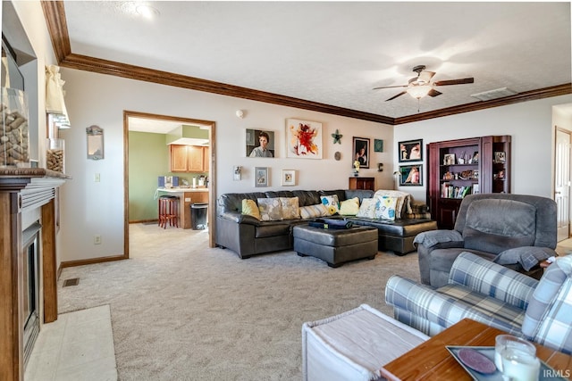 living room with a fireplace with flush hearth, light colored carpet, a ceiling fan, and ornamental molding