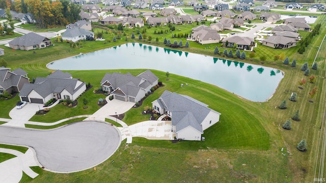 bird's eye view with a residential view and a water view