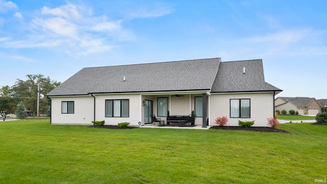 back of property with a patio, an outdoor living space, a shingled roof, ceiling fan, and a lawn