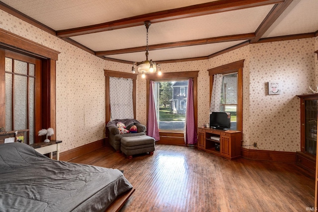 bedroom with beam ceiling, wallpapered walls, and light wood-type flooring