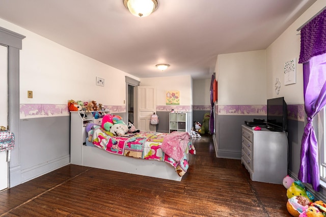 bedroom featuring wood finished floors