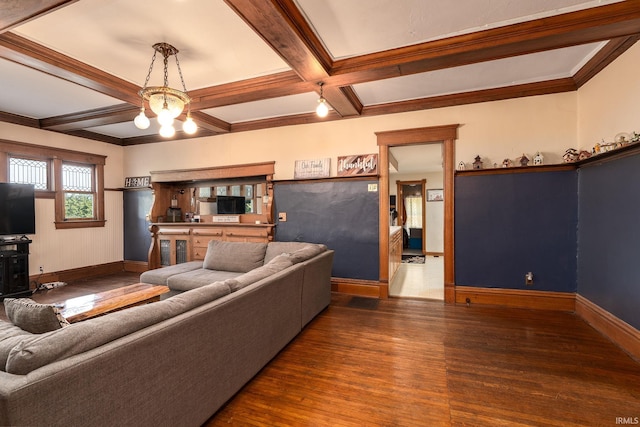 living room featuring baseboards, a chandelier, beam ceiling, wood finished floors, and coffered ceiling