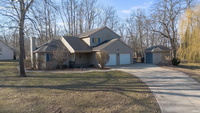 view of front of property with a garage, an outdoor structure, concrete driveway, and a front lawn