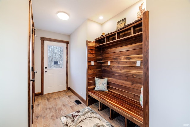 mudroom with baseboards and light wood finished floors