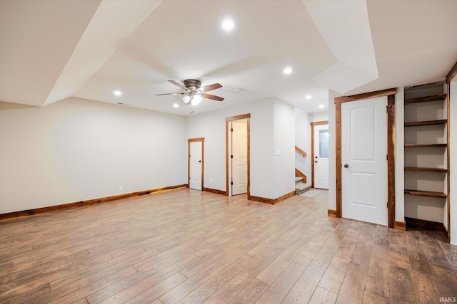 interior space featuring recessed lighting, light wood-style flooring, a ceiling fan, and baseboards