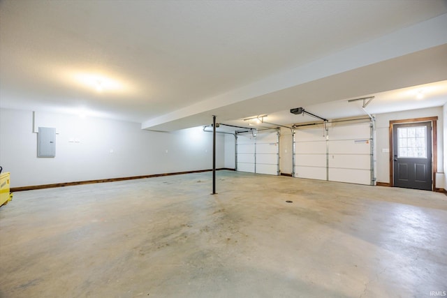 garage with electric panel, a garage door opener, and baseboards