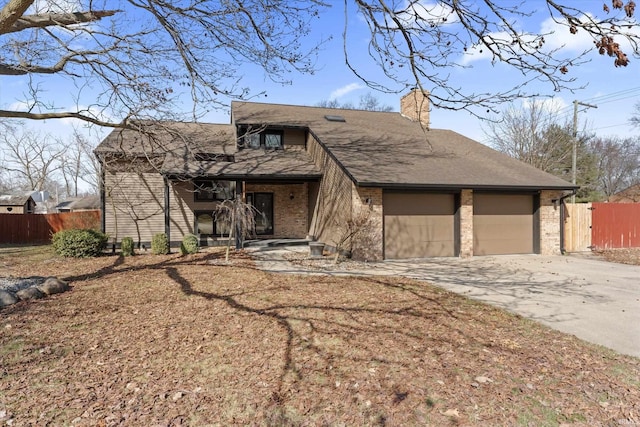 mid-century inspired home featuring fence, driveway, an attached garage, a chimney, and brick siding