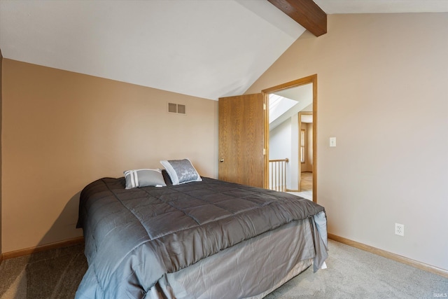 bedroom with visible vents, light carpet, baseboards, and vaulted ceiling with beams