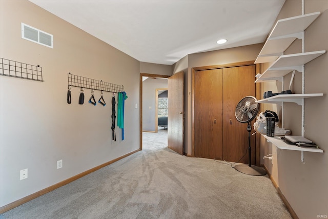 corridor with recessed lighting, baseboards, visible vents, and light carpet