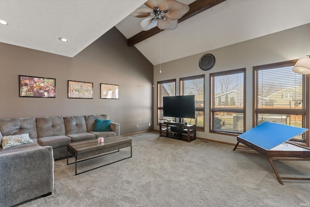 living room featuring baseboards, beamed ceiling, carpet flooring, high vaulted ceiling, and a ceiling fan