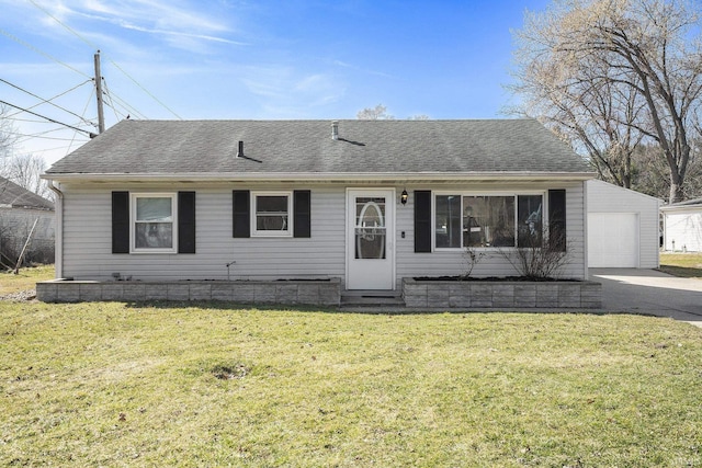 view of front facade with a front yard, a garage, driveway, and a shingled roof