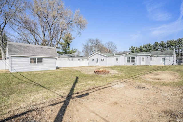 exterior space featuring an outbuilding and fence