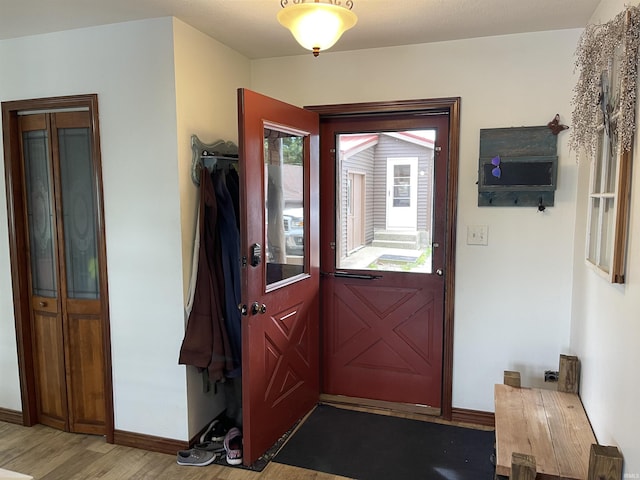 entryway featuring light wood-type flooring and baseboards