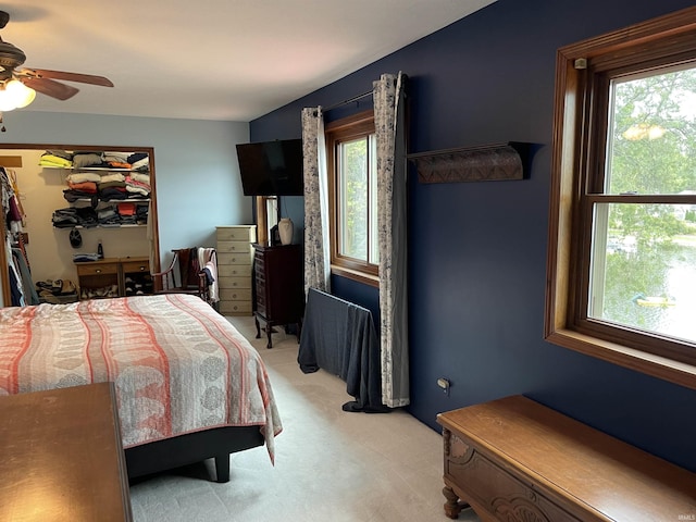 bedroom featuring light carpet