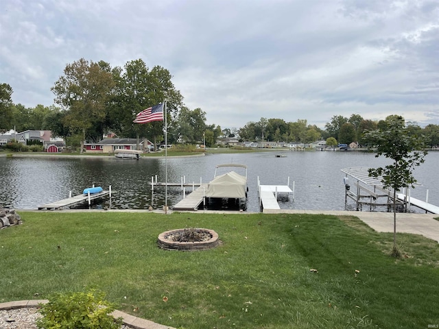 view of dock featuring a yard and a water view