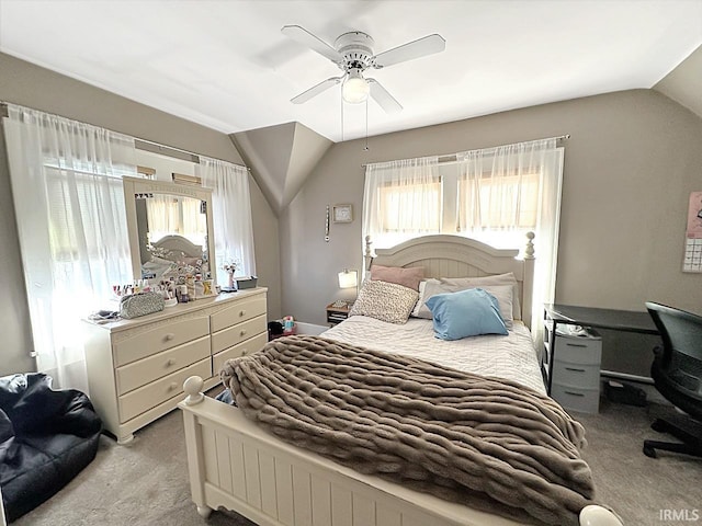 bedroom with carpet flooring, ceiling fan, and vaulted ceiling