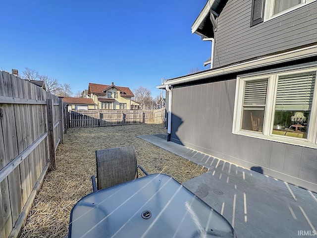 view of yard with a patio area, a jacuzzi, and a fenced backyard