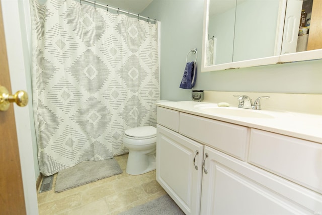 bathroom with visible vents, toilet, vanity, and a shower with curtain