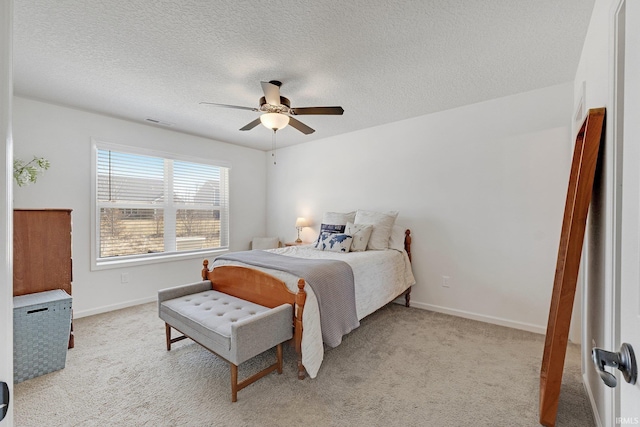 bedroom featuring visible vents, baseboards, light colored carpet, and ceiling fan