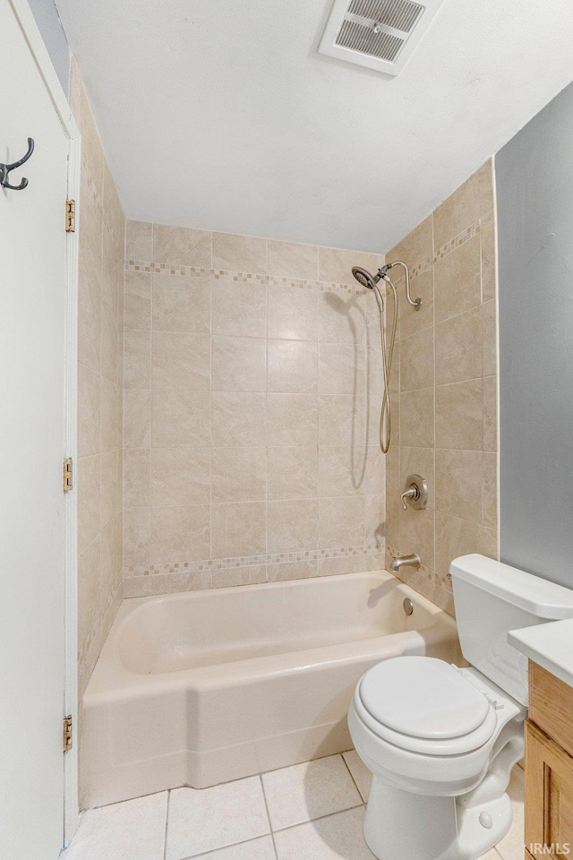 bathroom featuring visible vents, toilet, shower / washtub combination, tile patterned flooring, and vanity