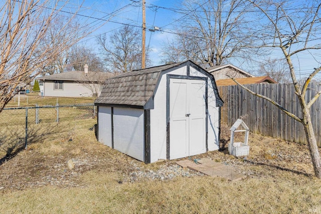 view of shed featuring a fenced backyard