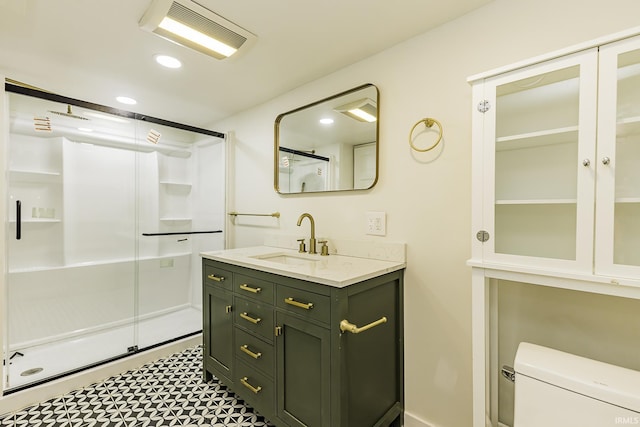 bathroom featuring visible vents, recessed lighting, a stall shower, and vanity