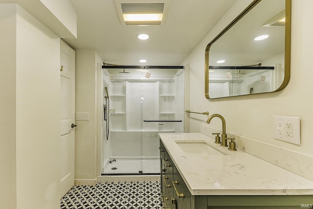 bathroom featuring recessed lighting, visible vents, a stall shower, and vanity