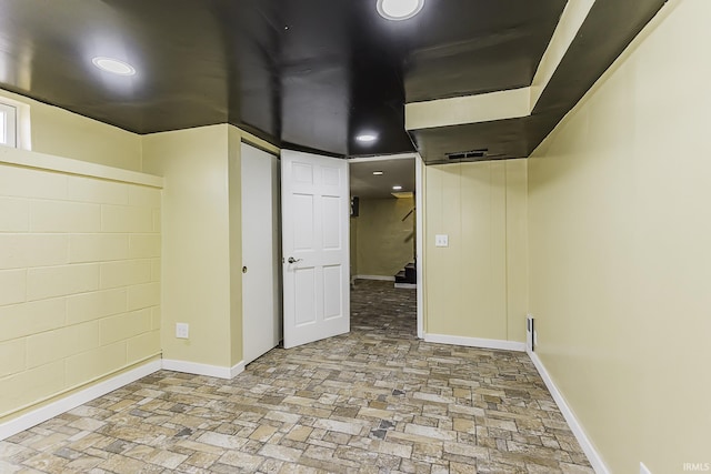 finished basement featuring baseboards