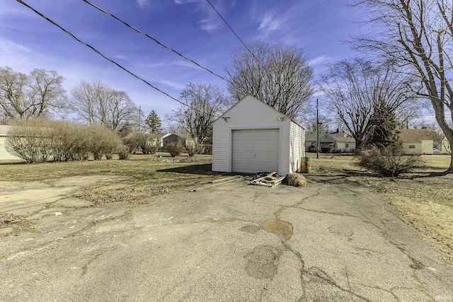 detached garage featuring driveway