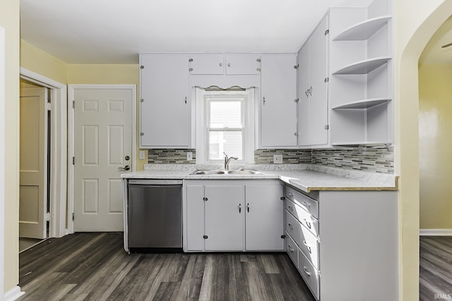 kitchen with dishwasher, open shelves, dark wood finished floors, and a sink