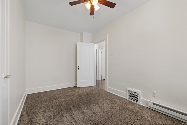 carpeted empty room featuring visible vents, baseboards, a baseboard heating unit, and a ceiling fan