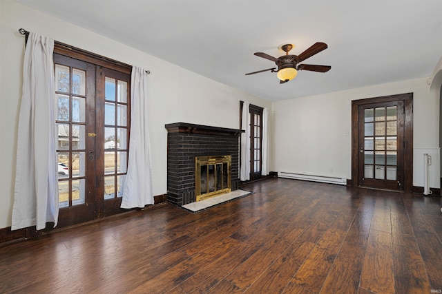 unfurnished living room featuring hardwood / wood-style flooring, a healthy amount of sunlight, french doors, and a baseboard radiator